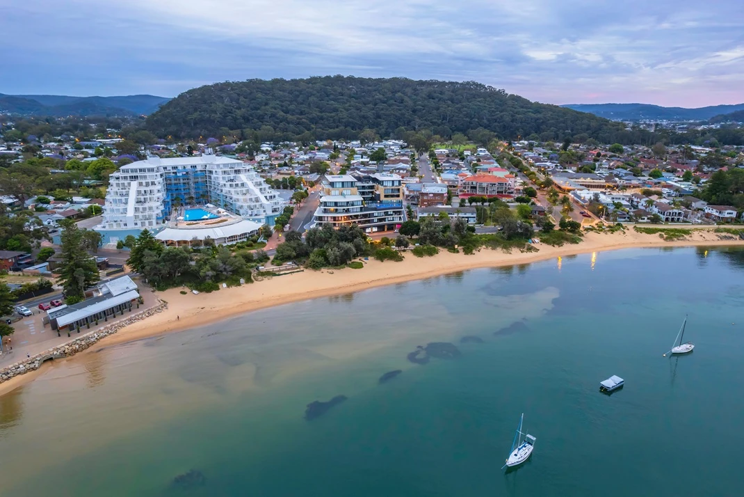 Aerial sunrise view of Ettalong Beach on the Central Coast, NSW, Australia. Providing Non-Destructive testing services to the Central Coast and surrounds